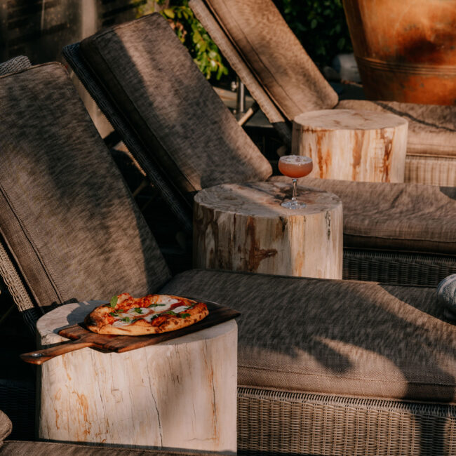 Poolside cocktail and pizza