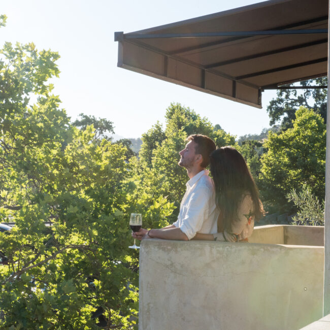 Couple overlooking balcony at North Block Hotel